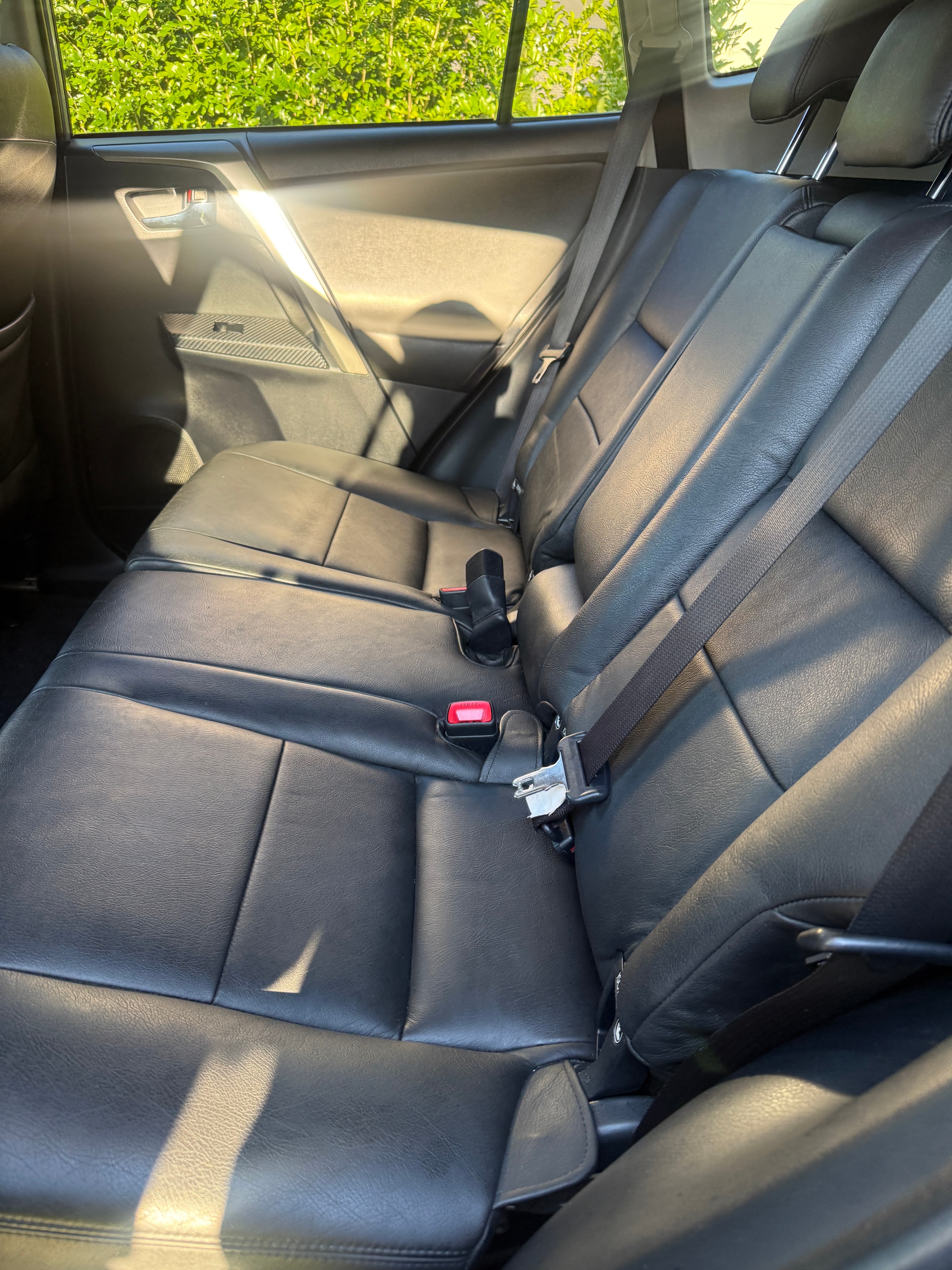 Rear leather seats after — clean and conditioned