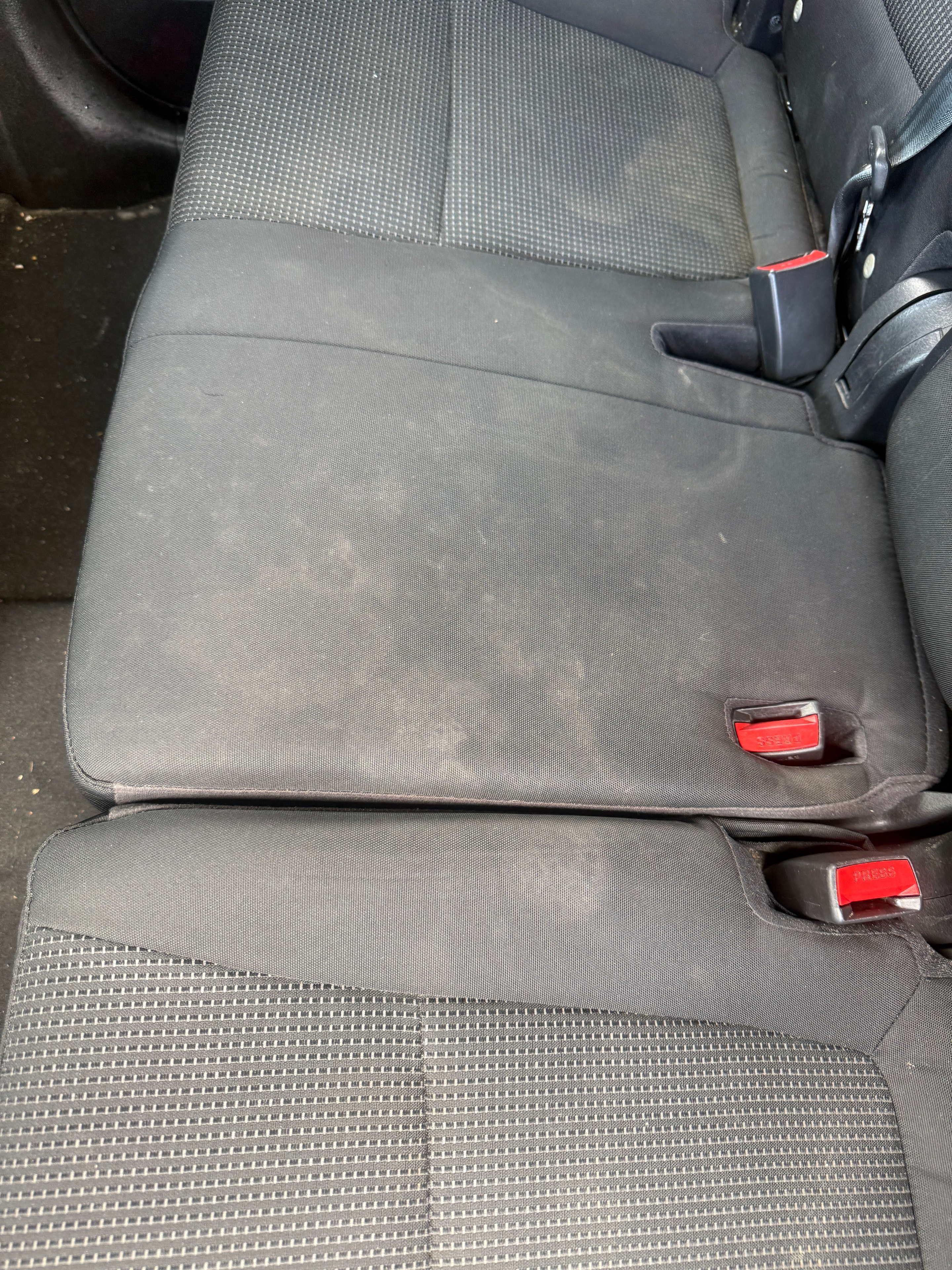 Rear seats before — stained fabric